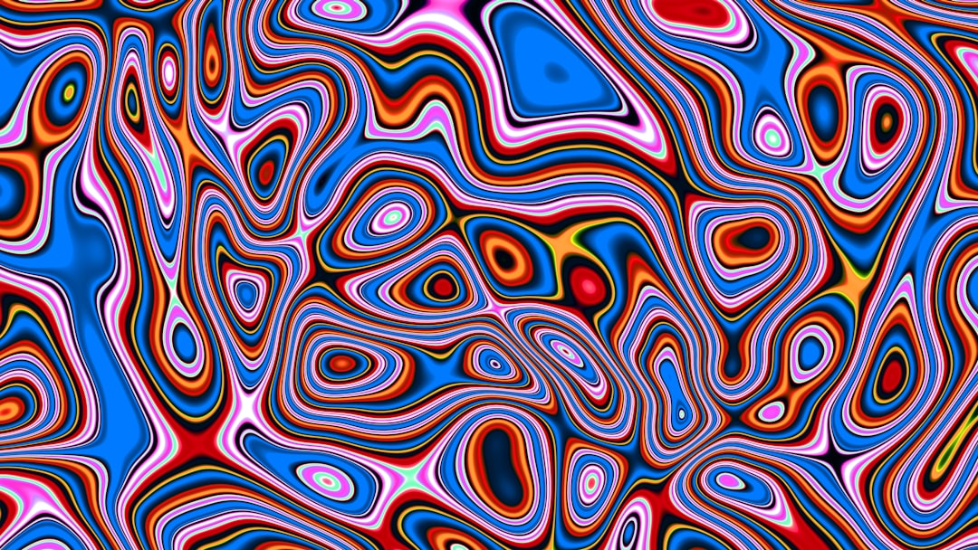 Abstract swirling pattern of bright colors — Photo by Logan Voss on Unsplash