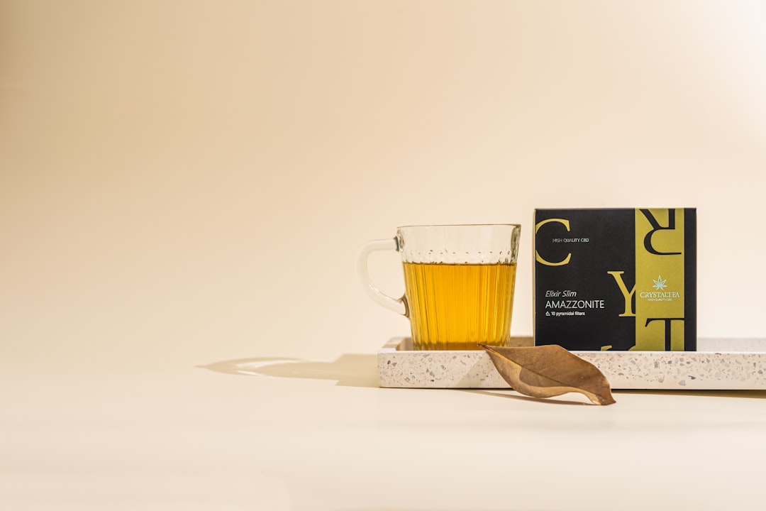 a wooden spoon sitting next to a glass of beer — Photo by CRYSTALWEED cannabis on Unsplash