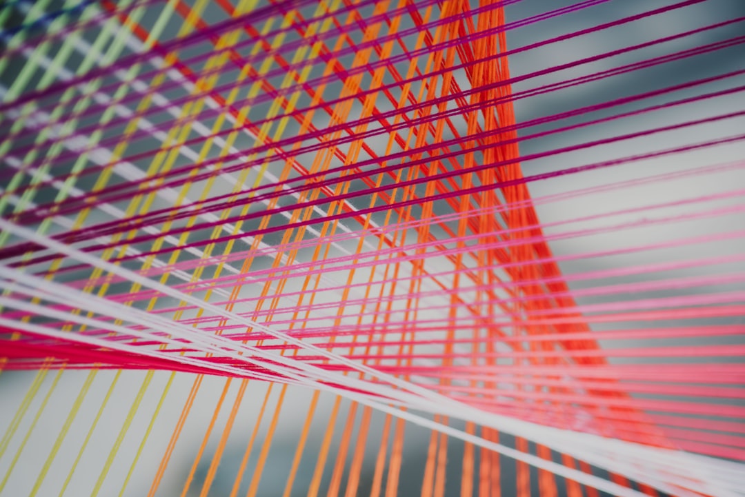 close-up photo of intertwining strings — Photo by CHUTTERSNAP on Unsplash