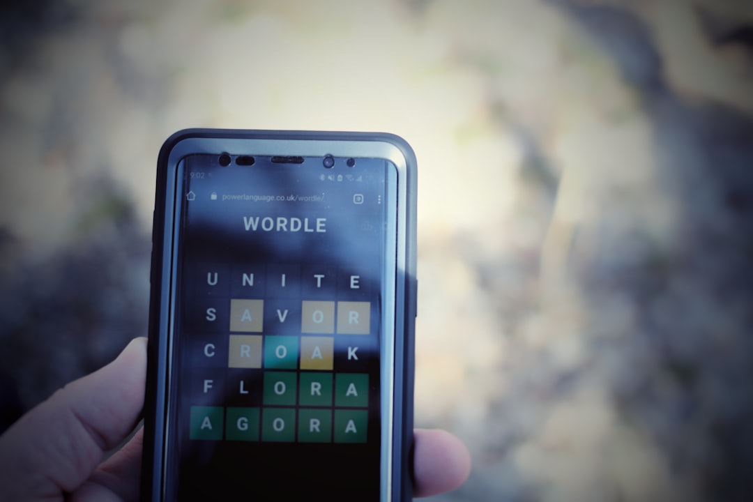 a person holding a cell phone — Photo by Joshua Hoehne on Unsplash