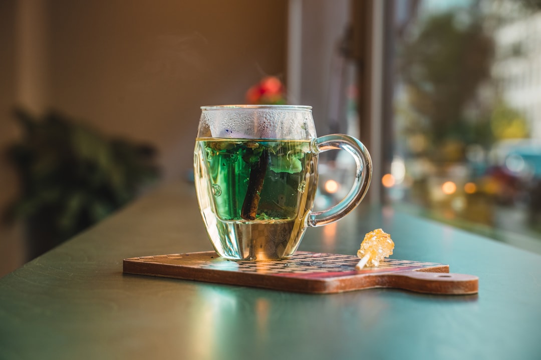 clear glass mug with green liquid inside — Photo by Leon Seibert on Unsplash