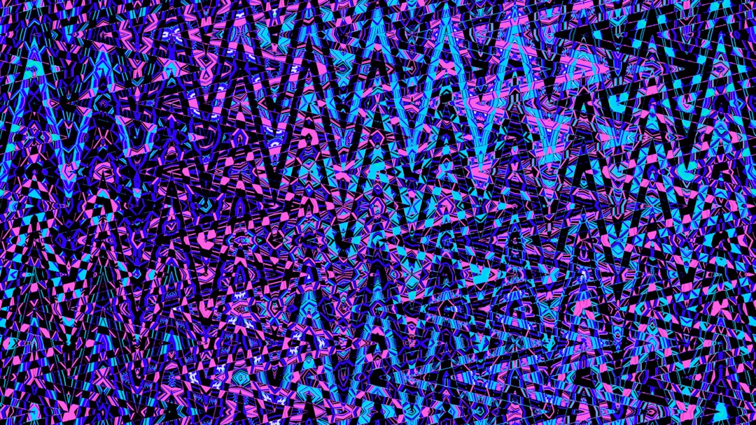 Abstract, colorful zigzags dominate the image. — Photo by Logan Voss on Unsplash