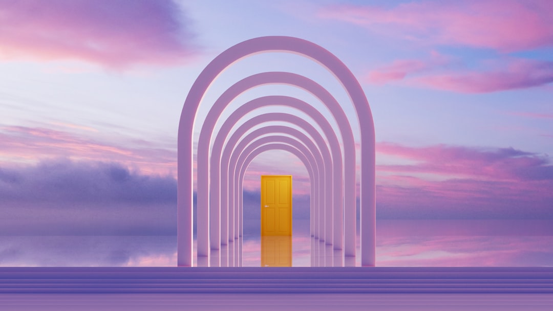 Archway leading to a golden door at sunset — Photo by BROTHERHOOD STUDIO on Unsplash