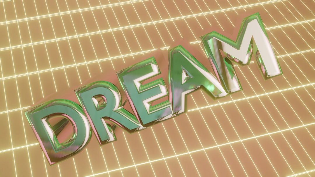 The word "dream" in 3D letters on a glowing grid — Photo by Logan Voss on Unsplash