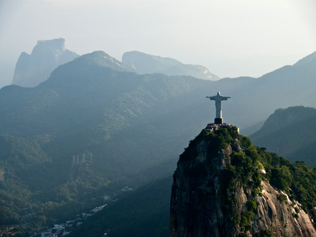 a statue of jesus on top of a mountain — Photo by gustavo nacht on Unsplash