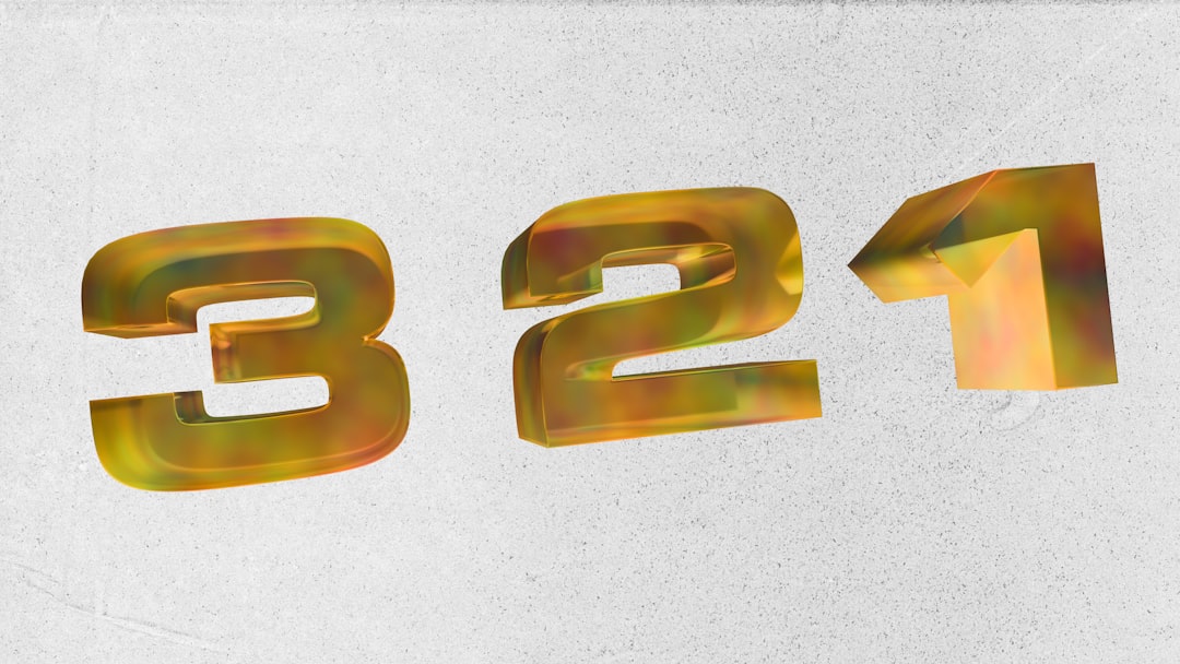 Golden numbers 3, 2, 1 on a textured background — Photo by Logan Voss on Unsplash