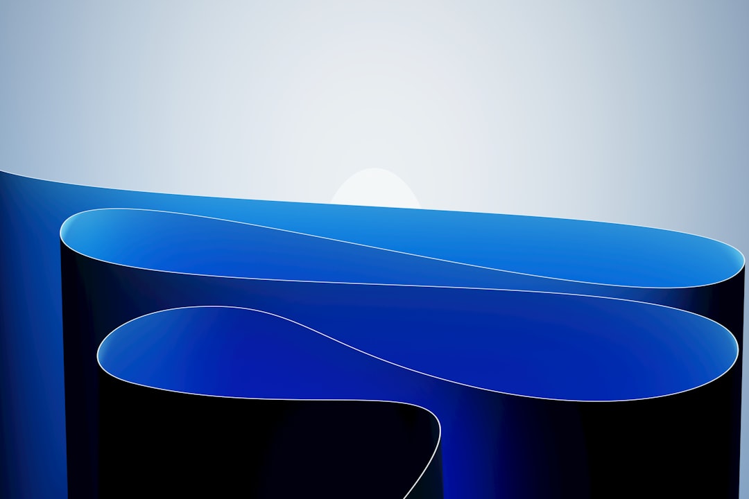 Abstract blue waves with a white circle — Photo by Hassaan Here on Unsplash