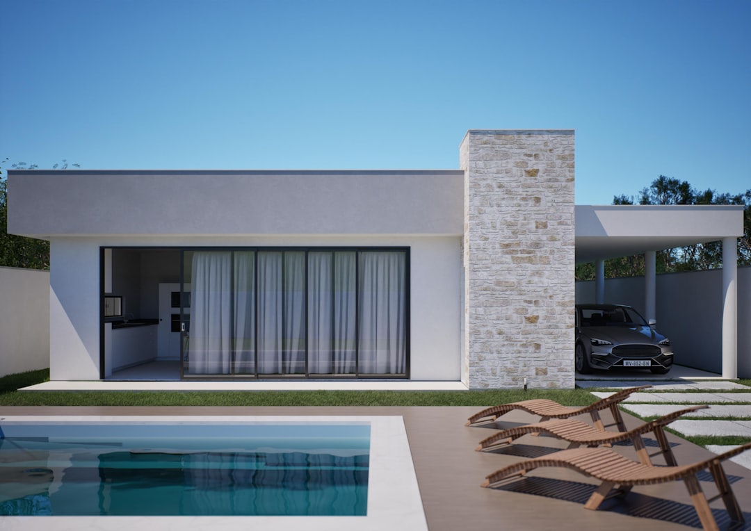Modern house with swimming pool and car — Photo by Esphera ArqEng on Unsplash