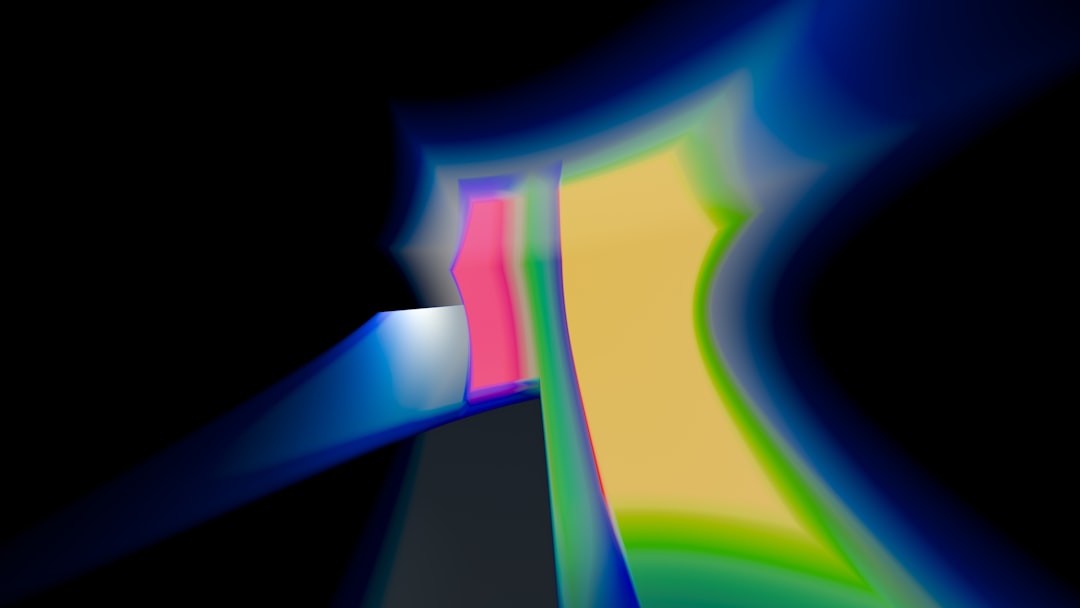 A blurry image of a black background with blue and yellow lines — Photo by Steve A Johnson on Unsplash
