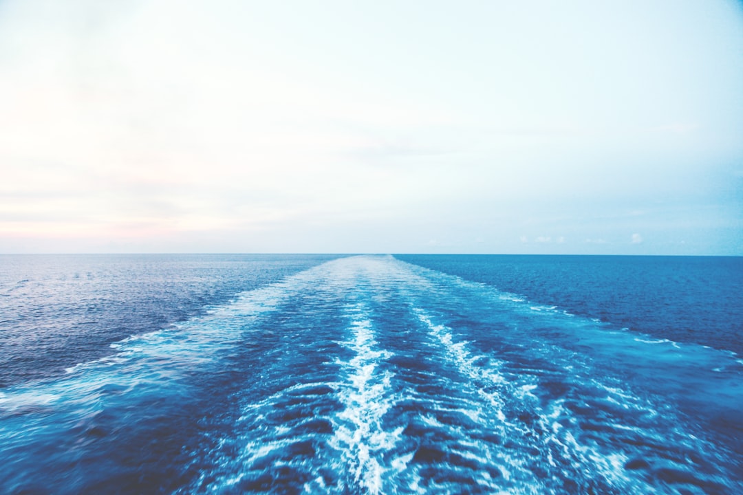 blue ocean water under white sky — Photo by Clem Onojeghuo on Unsplash