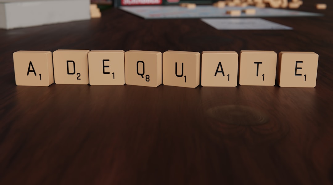 Scrabble tiles spell out the word adequate. — Photo by Anders Bengs on Unsplash