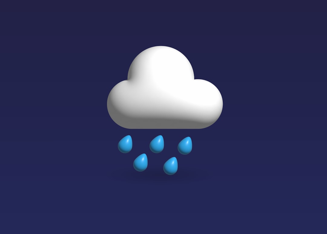 a white cloud with blue rain drops on a dark blue background — Photo by Abid Shah on Unsplash